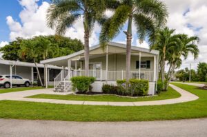 A view of a house with a lush lawn